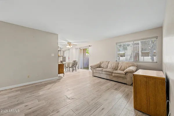 a living room with furniture and a window