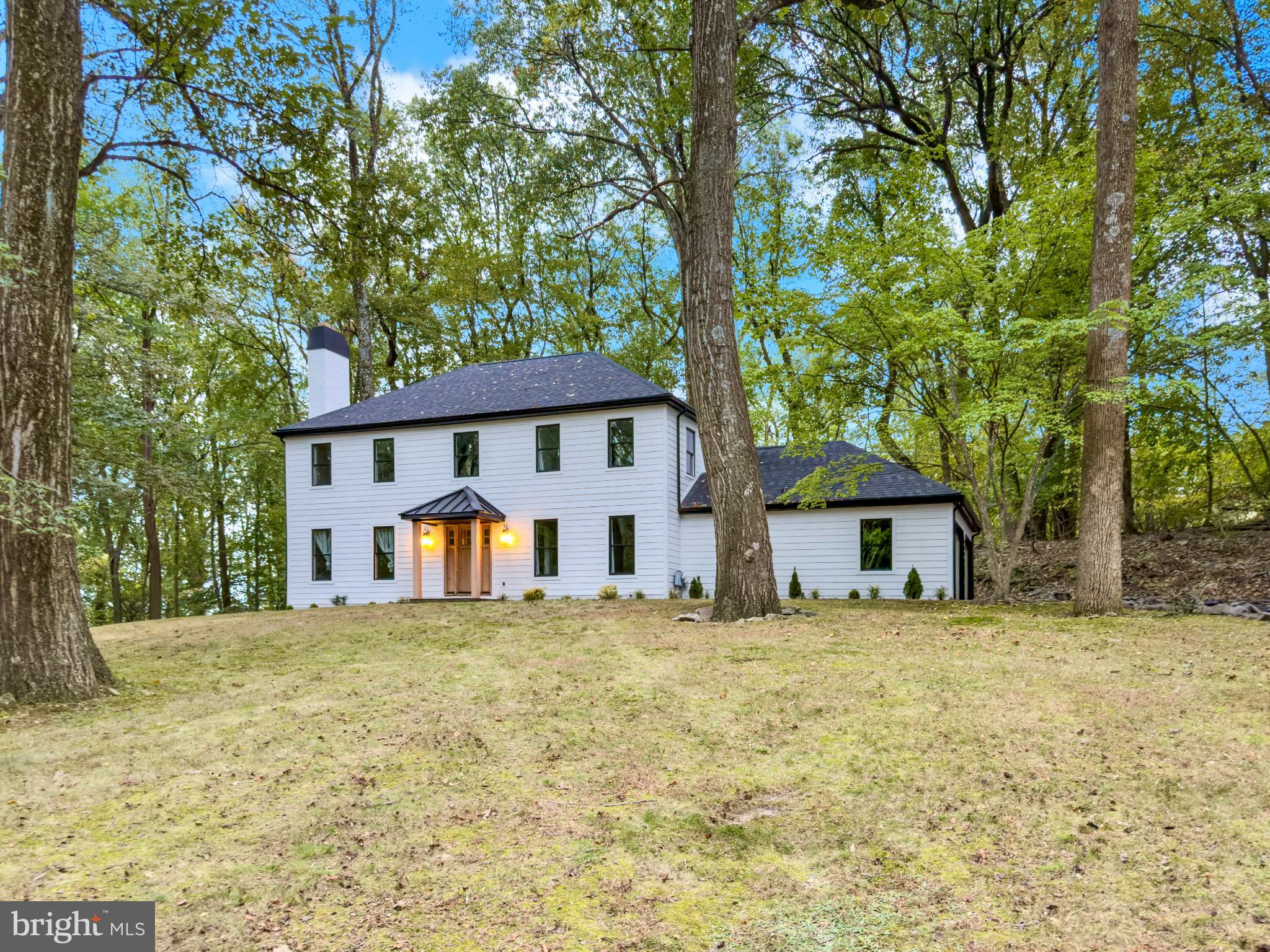 a house with trees in the background