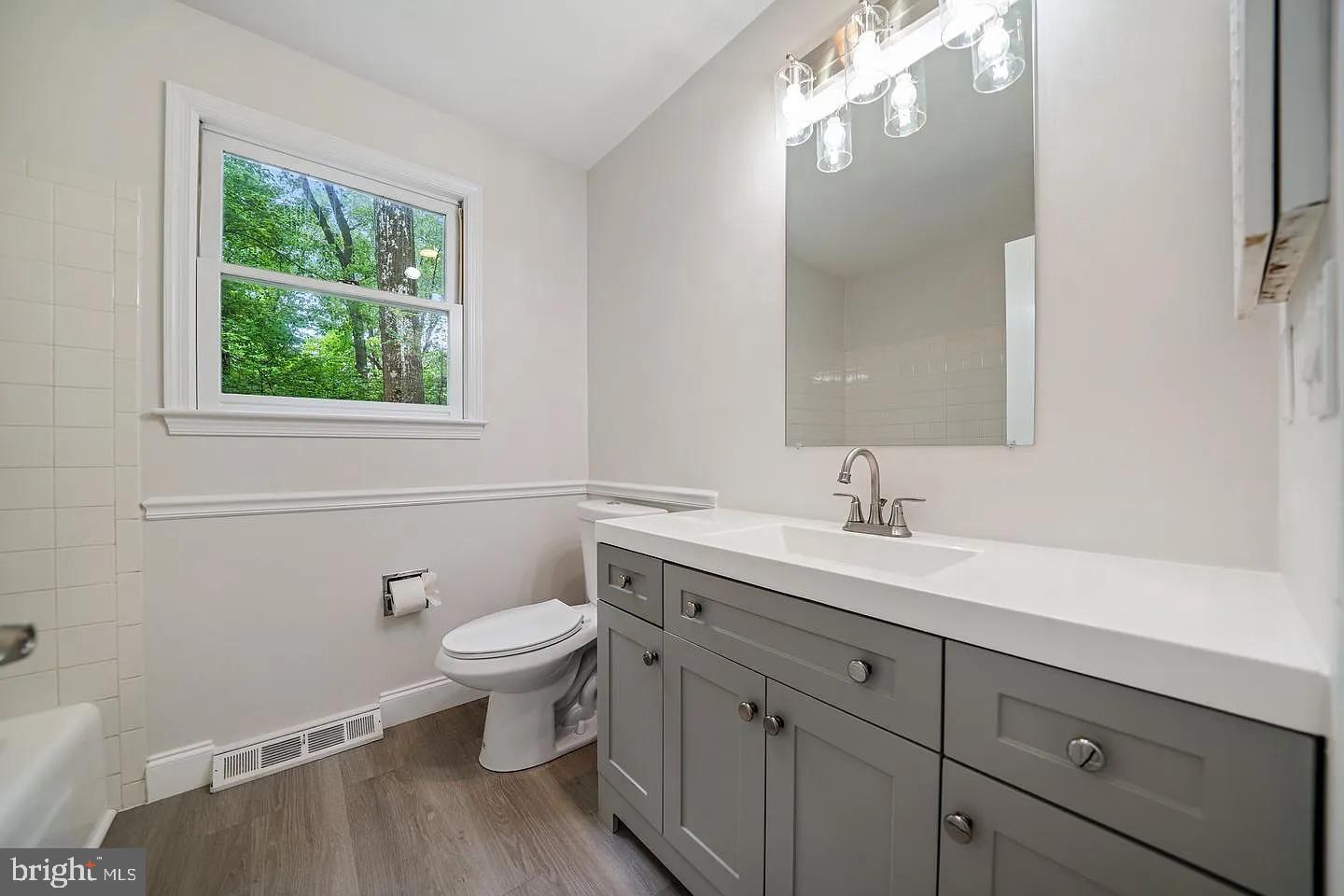 11 Oak Lane Malvern, PA 19355 - Photo 29 of 34 a bathroom with a toilet sink and mirror