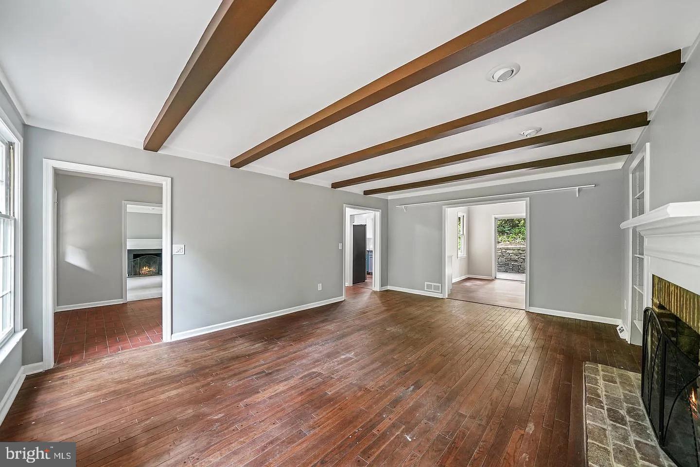 11 Oak Lane Malvern, PA 19355 - Photo 6 of 34 wooden floor in an empty room with a fireplace