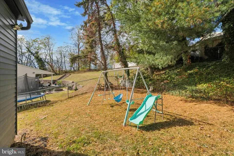 a view of a backyard with a slide