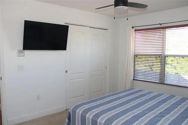 a bedroom with a bed and a dresser