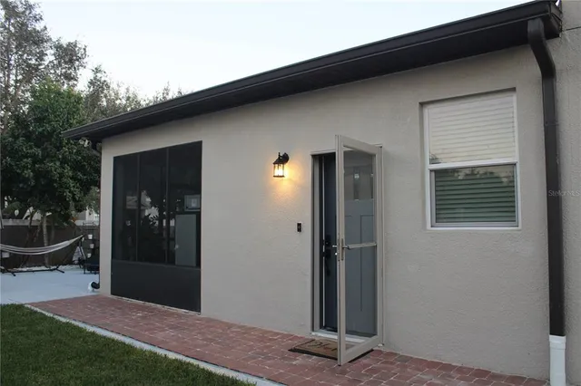 a view of a workspace with furniture and wooden floor