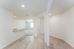 21163 Titan Drive Magnolia, TX 77355 - Photo 12 of 15 wooden floor in an empty room with a window