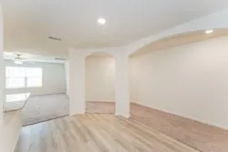 a view of an empty room and window