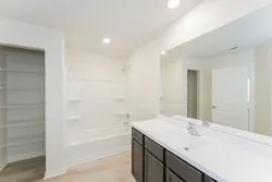 a bathroom with a bathtub and a sink