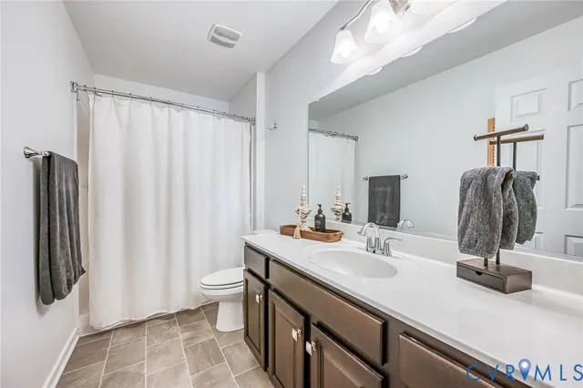 a bedroom with furniture and a fireplace