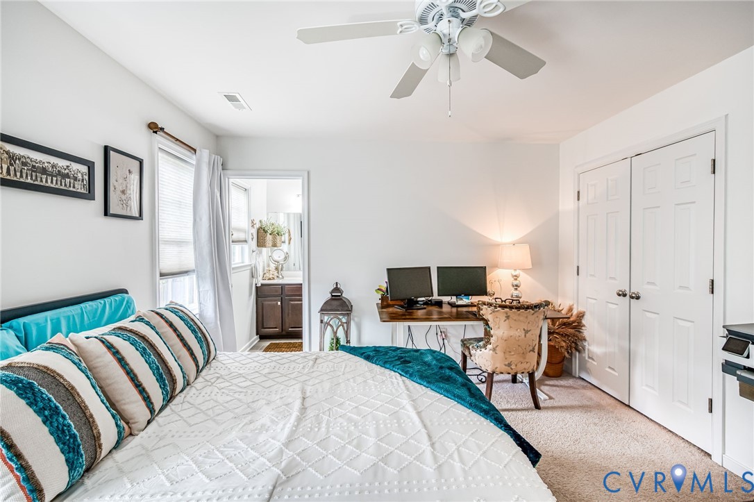 2077 Forest Circle Aylett, VA 23009 - Photo 24 of 36 a bedroom with furniture and a fireplace