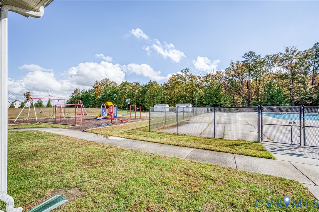 2077 Forest Circle Aylett, VA 23009 - Photo 31 of 36 View of Playground & Pools featuring a enclosed ga