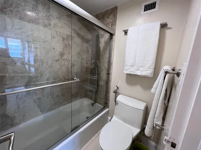 a bathroom with a tub and a shower