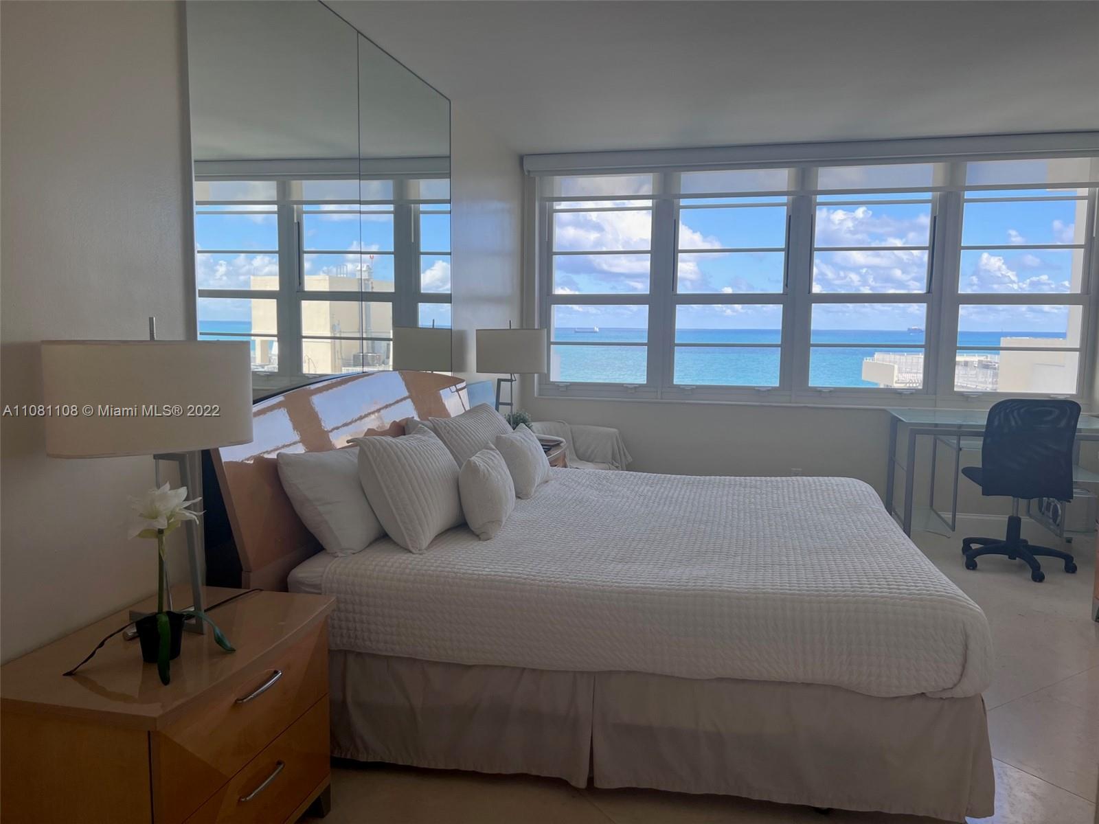 100 Lincoln Road, Unit 1121 Miami Beach, FL 33139 - Photo 15 of 22 a bed sitting in a bedroom next to a window