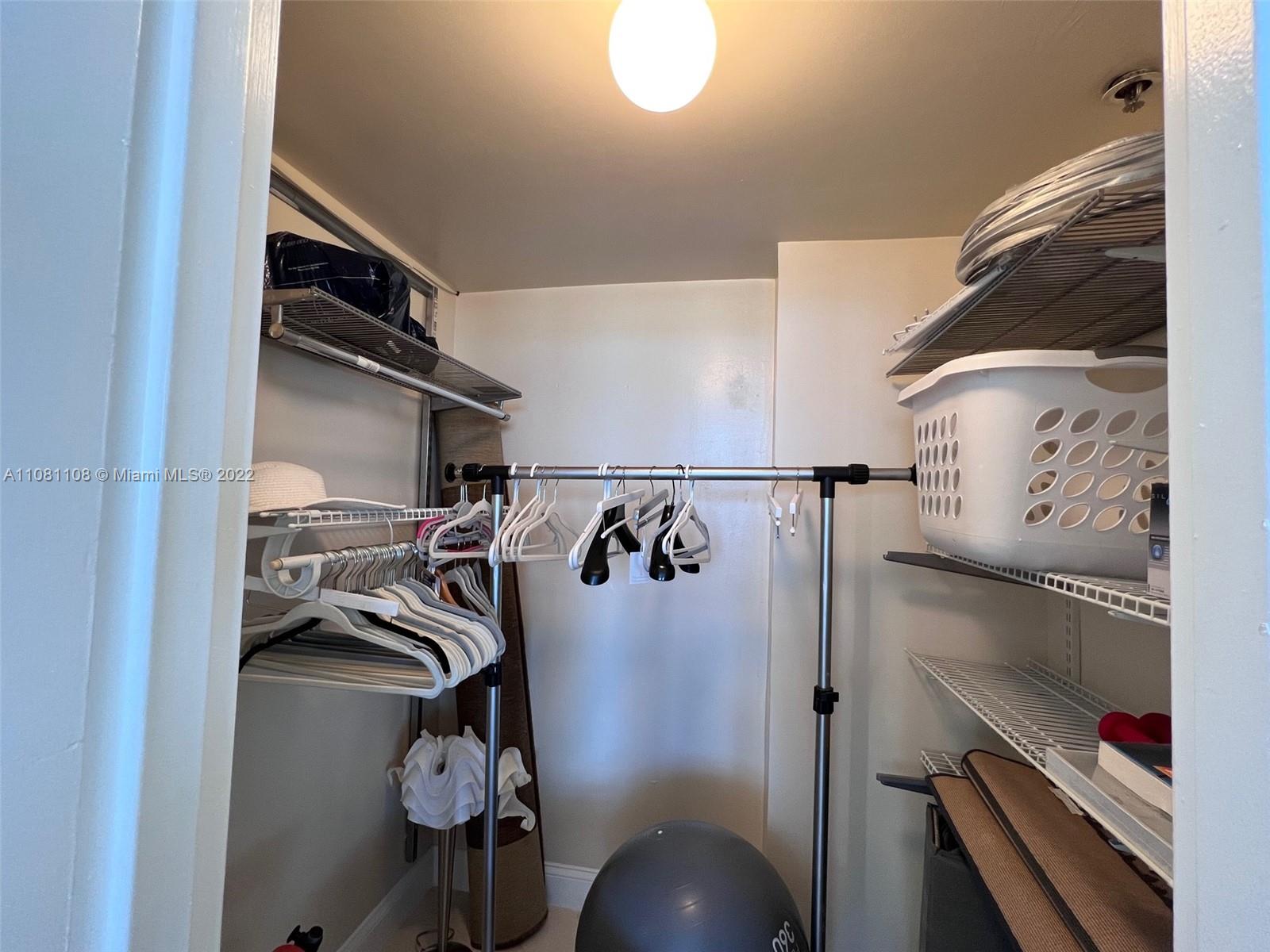 100 Lincoln Road, Unit 1121 Miami Beach, FL 33139 - Photo 17 of 22 a view of walk in closet with clothes and shoes