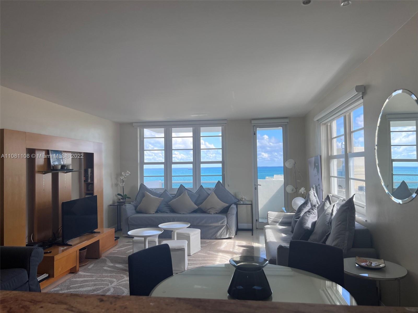 100 Lincoln Road, Unit 1121 Miami Beach, FL 33139 - Photo 3 of 22 a living room with furniture a rug and a flat screen tv