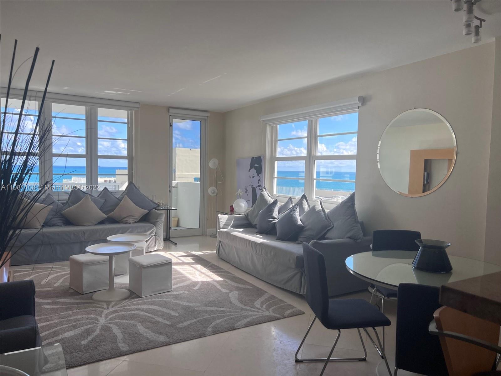 100 Lincoln Road, Unit 1121 Miami Beach, FL 33139 - Photo 4 of 22 a living room with furniture and a large window