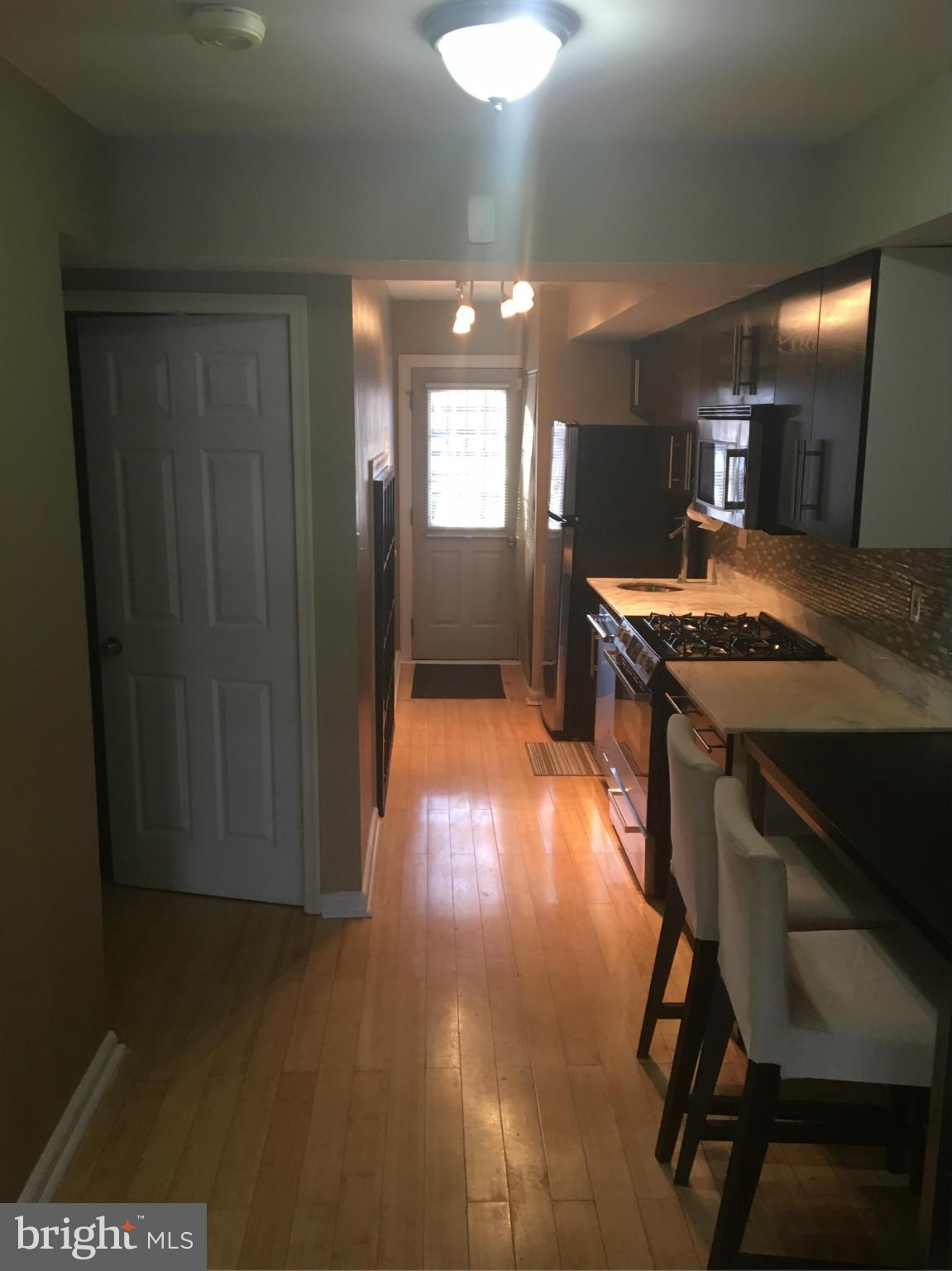 5039 Benning Road Southeast Washington, DC 20019 - Photo 18 of 23 Kitchen and 1st bedroom entryway