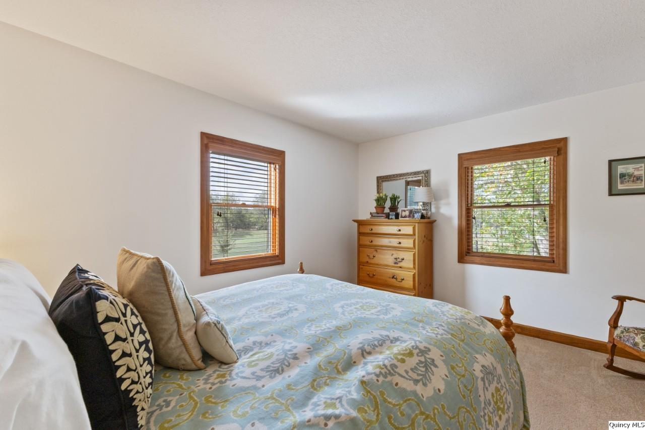 8508 Centerville Road Hannibal, MO 63401 - Photo 15 of 36 a bedroom with a bed and a window