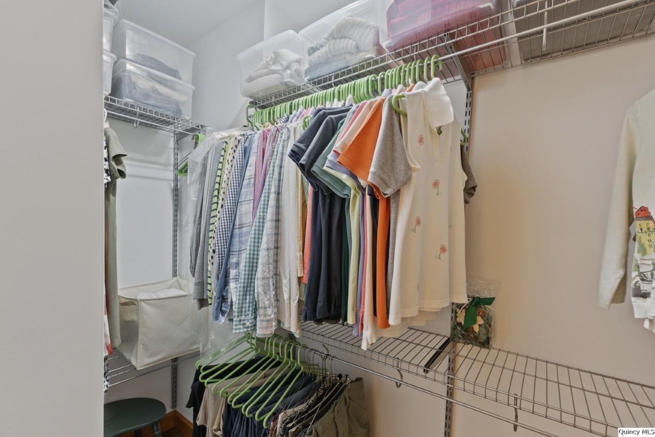 8508 Centerville Road Hannibal, MO 63401 - Photo 19 of 36 a view of walk in closet with clothes and shoes