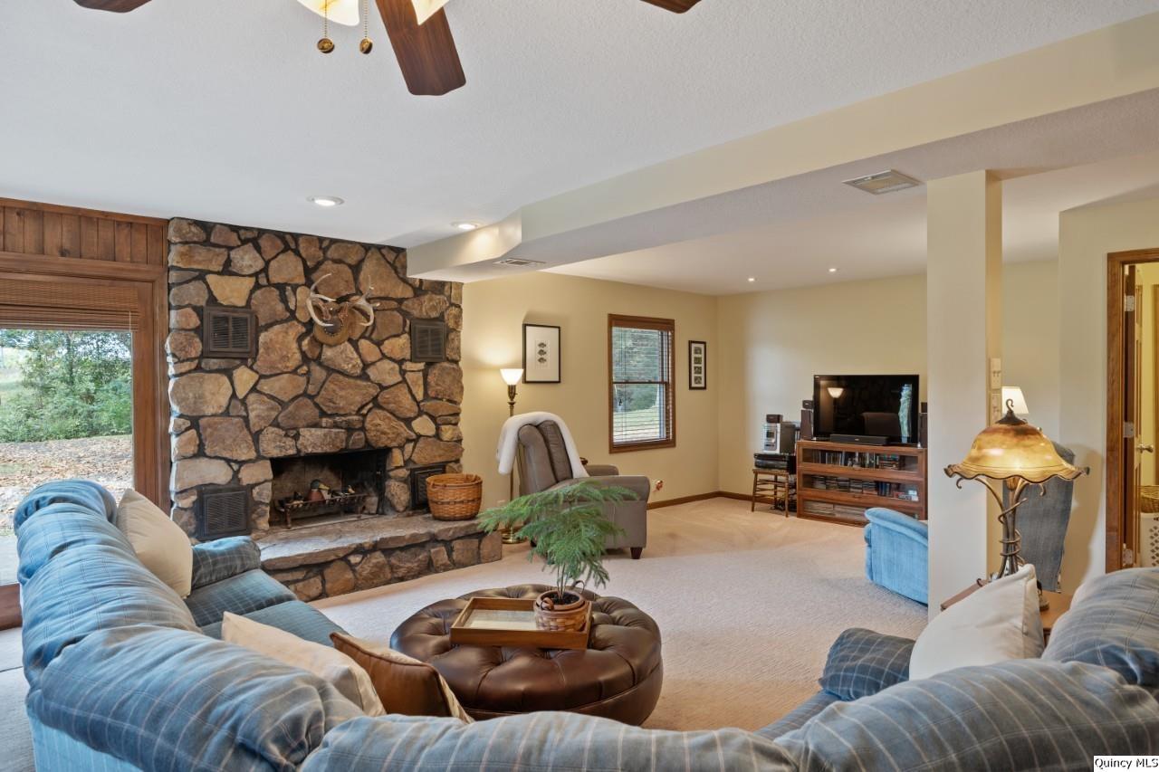 8508 Centerville Road Hannibal, MO 63401 - Photo 25 of 36 a living room with furniture and a flat screen tv