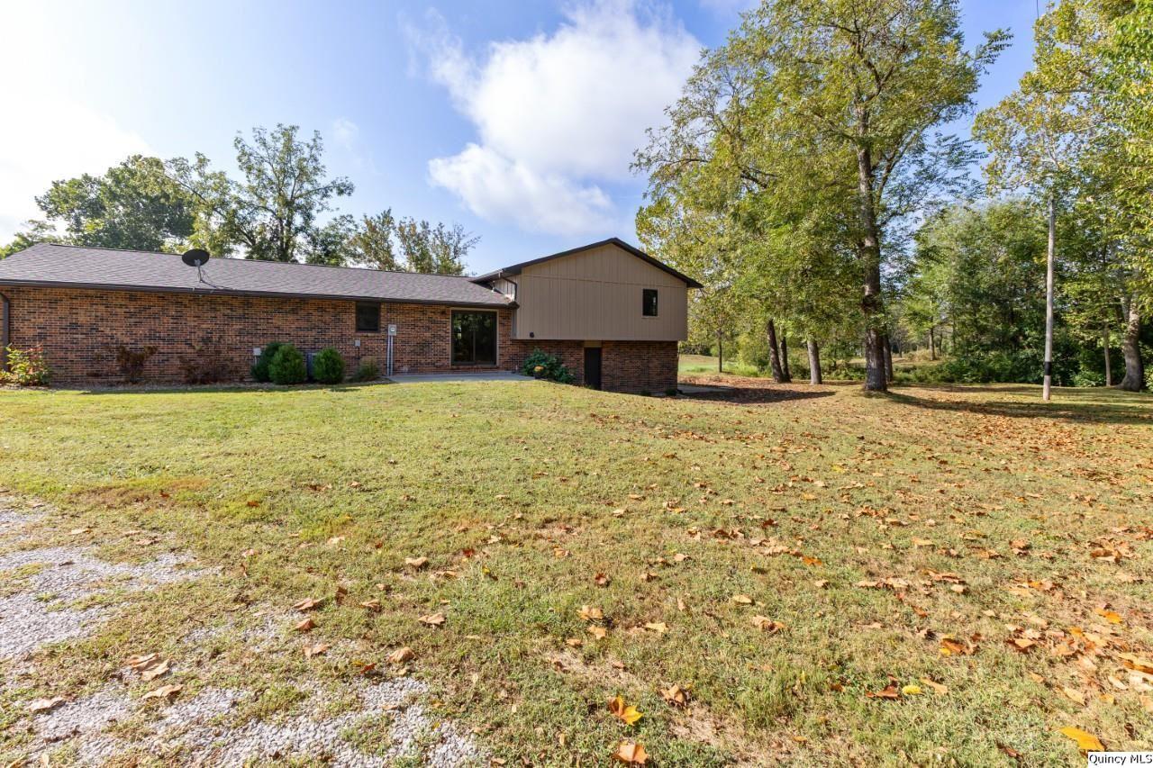 8508 Centerville Road Hannibal, MO 63401 - Photo 29 of 36 a house with yard in front of it