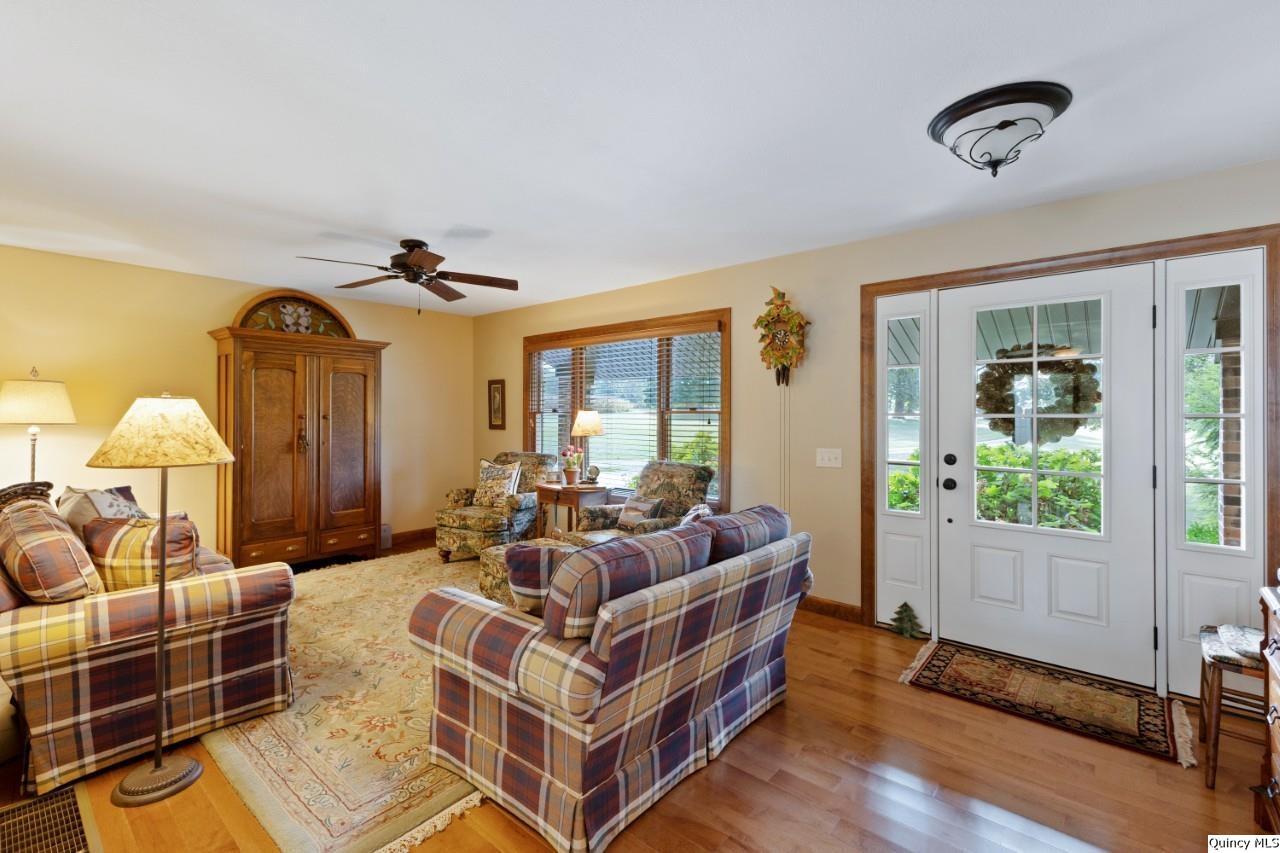 8508 Centerville Road Hannibal, MO 63401 - Photo 3 of 36 a spacious bedroom with a bed and wooden floor