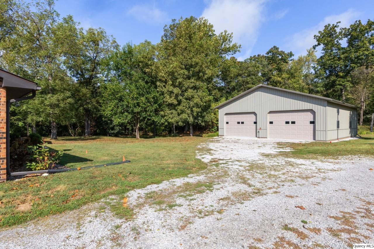 8508 Centerville Road Hannibal, MO 63401 - Photo 31 of 36 a house view with a garden space