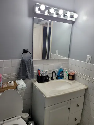 a bathroom with a sink and mirror