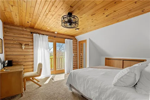 a bedroom with a bed and ceiling fan