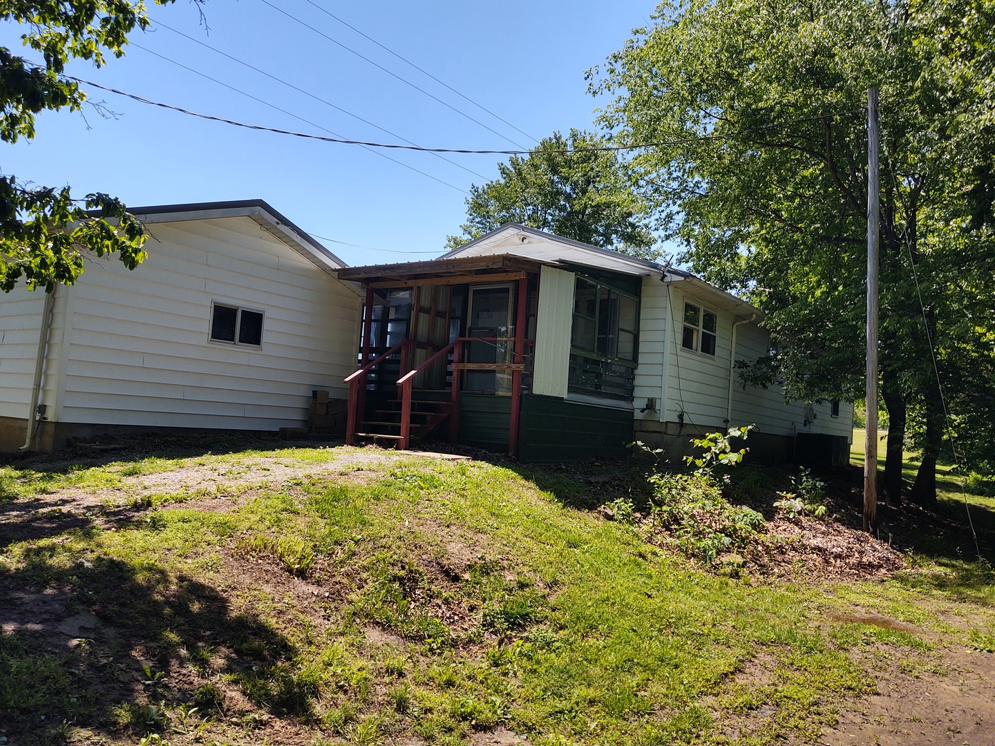 1045 Ozark Road Ozark, IL 62972 - Photo 6 of 17 a front view of a house with a yard
