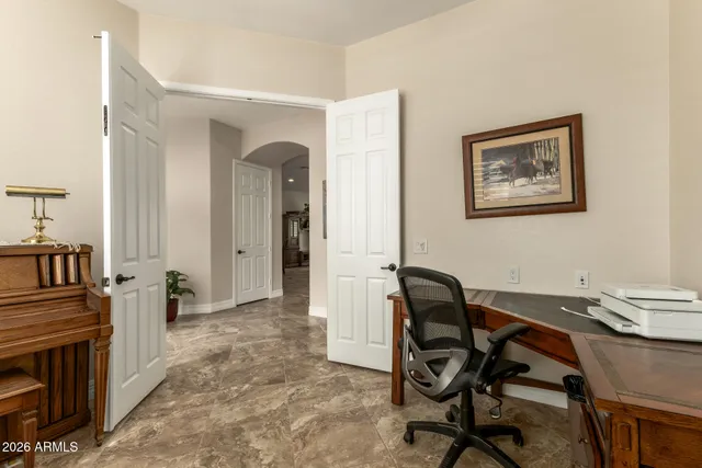 a view of a workspace with furniture and a stove