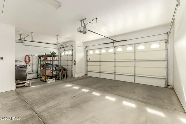 a view of a garage with rack and bicycle