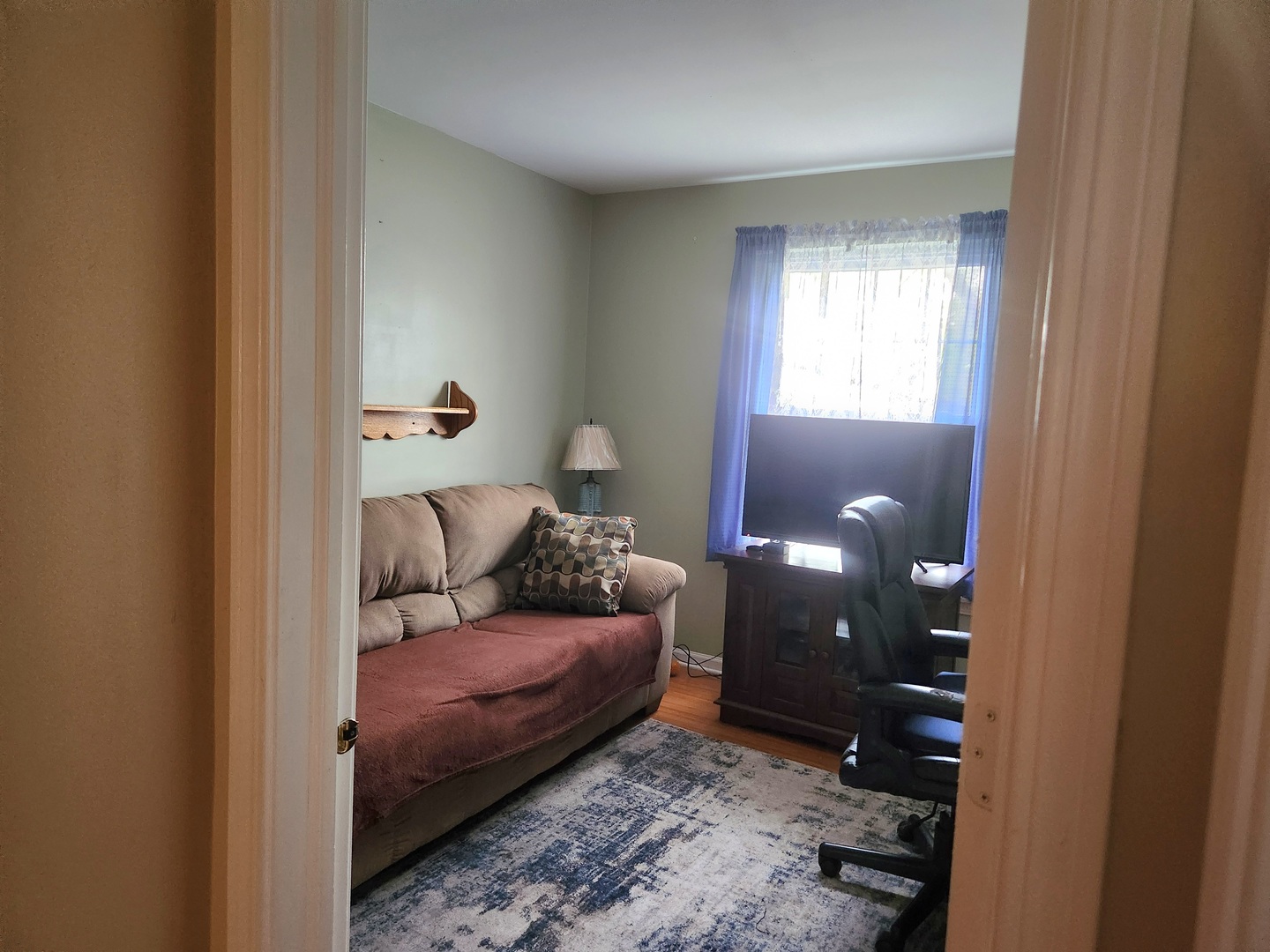 1013 Saxon Court, Unit B Elgin, IL 60120 - Photo 11 of 17 a living room with furniture and a window