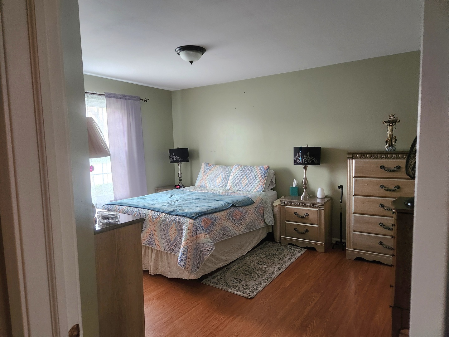 1013 Saxon Court, Unit B Elgin, IL 60120 - Photo 8 of 17 a bedroom with a bed and dresser