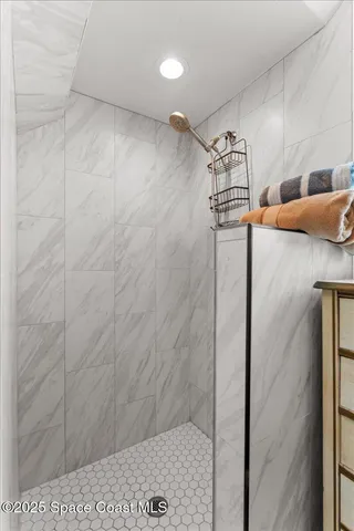 a view of kitchen with furniture and electronic appliances