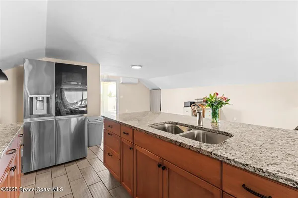 a bedroom with furniture and white walls