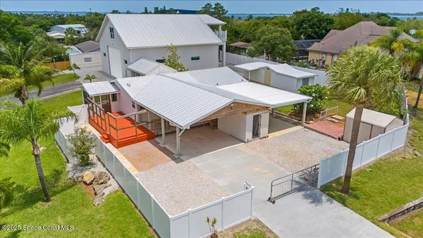 a front view of house with yard and trees