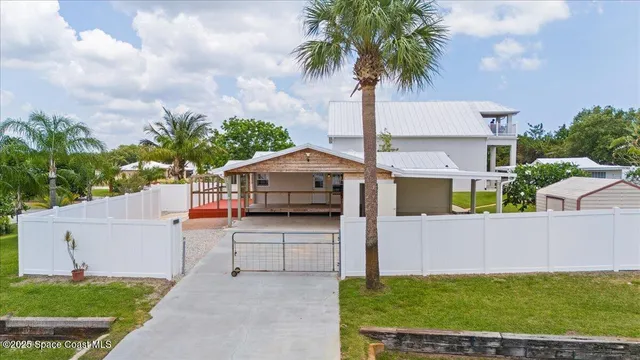a view of a house with a yard and garage