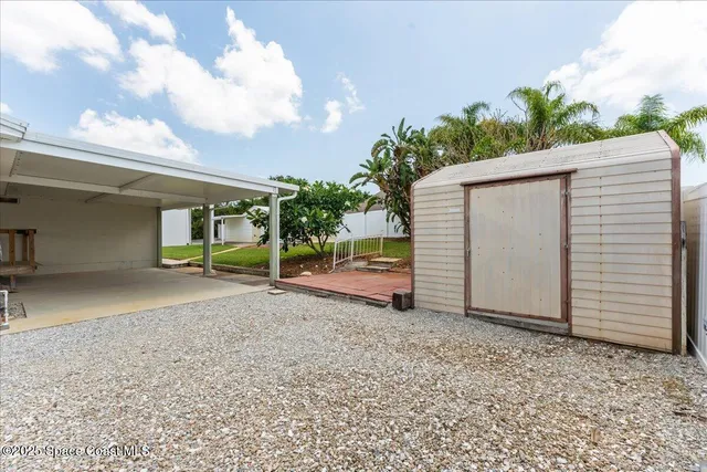 a view of a house with a yard and garage