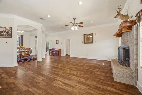 a view of a livingroom with furniture and a ceiling fan