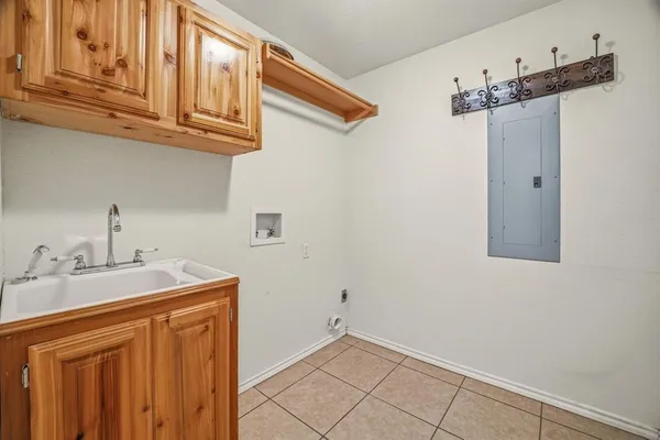 a bathroom with a sink and cabinets