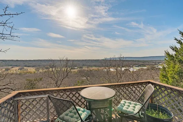a view of a balcony with an ocean view