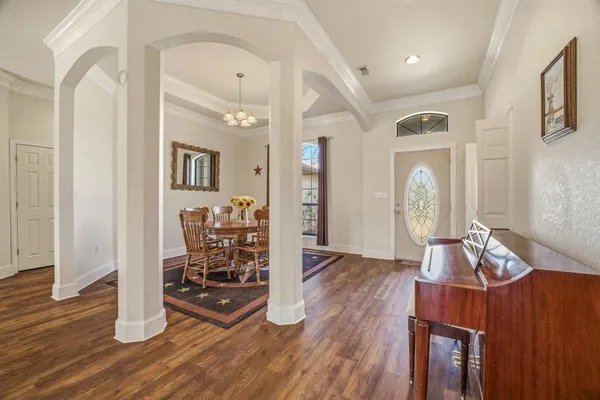 a view of a livingroom with furniture and wooden floor