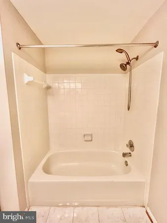 a bathroom with a bath tub