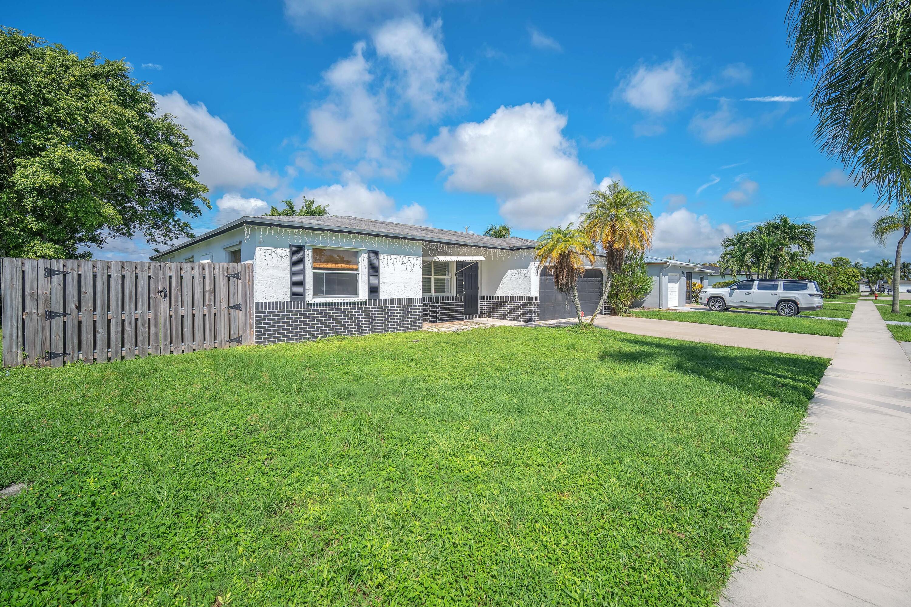 10985 Christopher Avenue Boca Raton, FL 33428 - Photo 24 of 24 Chris front of home