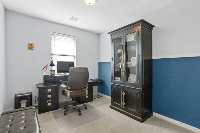 a view of workspace with wooden floor windows