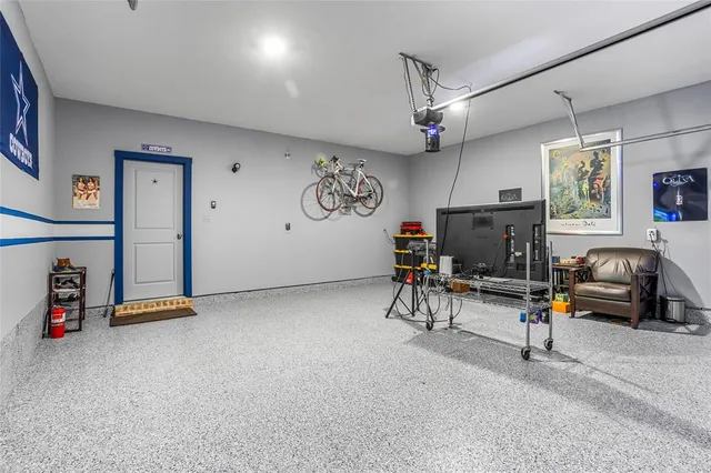 a view of a livingroom with furniture and a flat screen tv