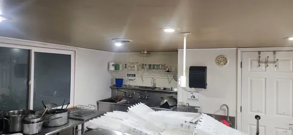 a bathroom with a sink mirror and shower