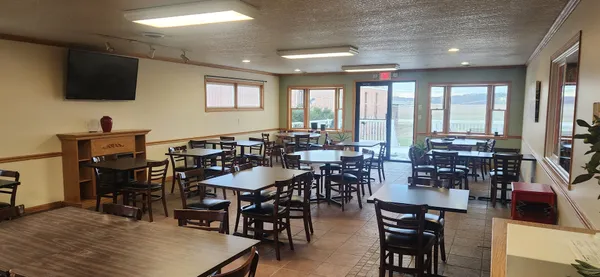 a view of a dining room with furniture