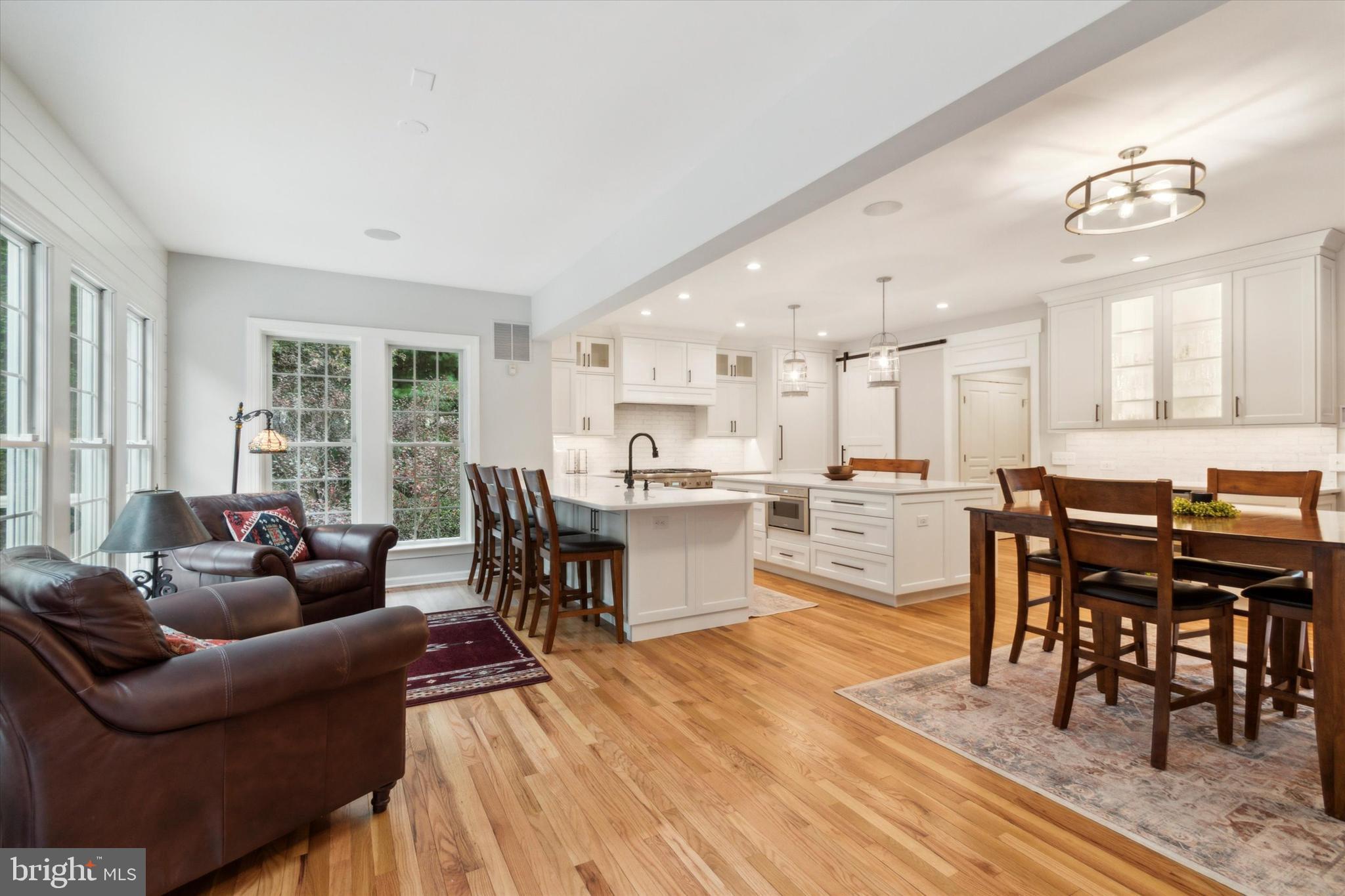1007 Ridgehaven Road West Chester, PA 19382 - Photo 11 of 36 a living room with stainless steel appliances kitchen island granite countertop furniture and a wooden floor