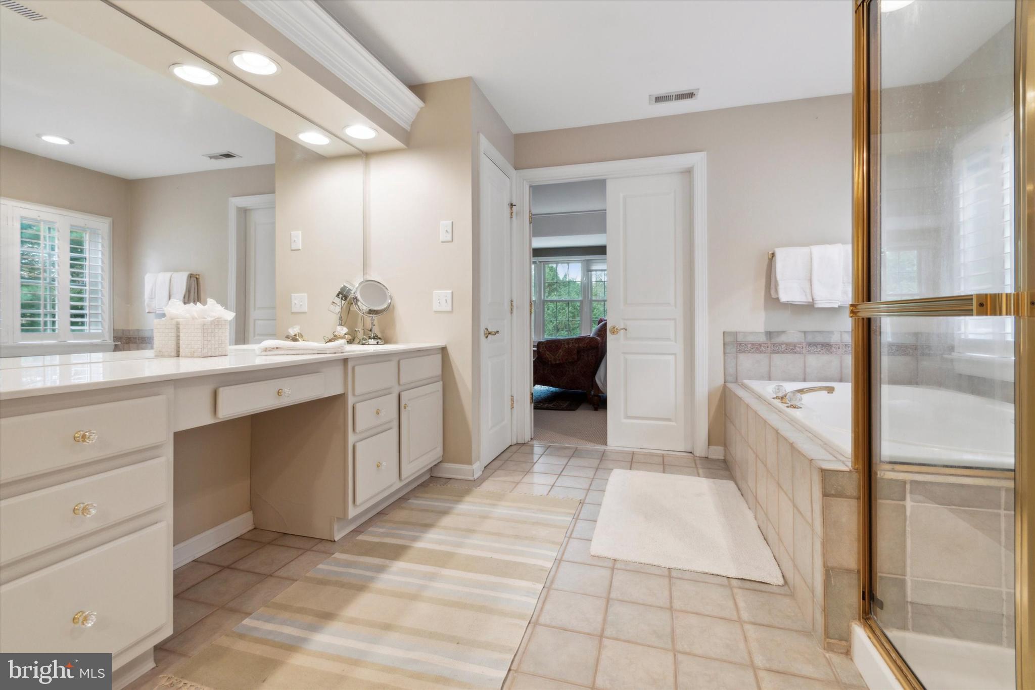 1007 Ridgehaven Road West Chester, PA 19382 - Photo 22 of 36 a large white kitchen with a granite countertop lots of white cabinets