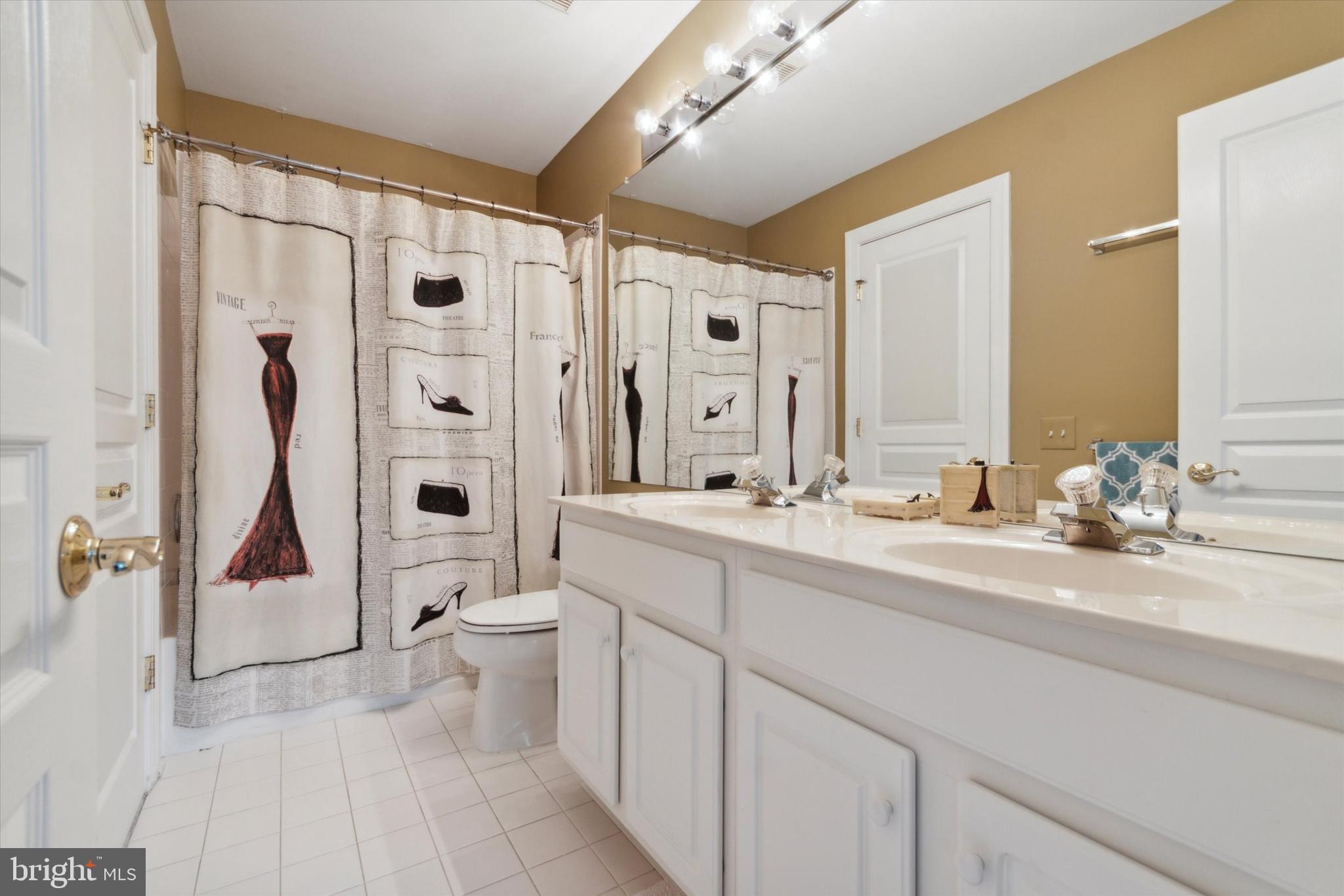 1007 Ridgehaven Road West Chester, PA 19382 - Photo 29 of 36 a bathroom with a double vanity sink toilet and shower